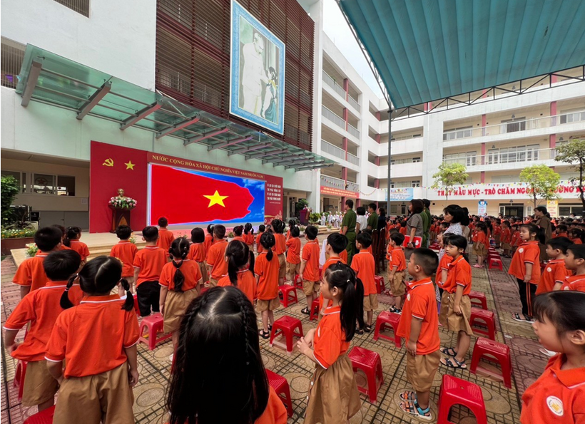 A group of children in orange shirts

Description automatically generated